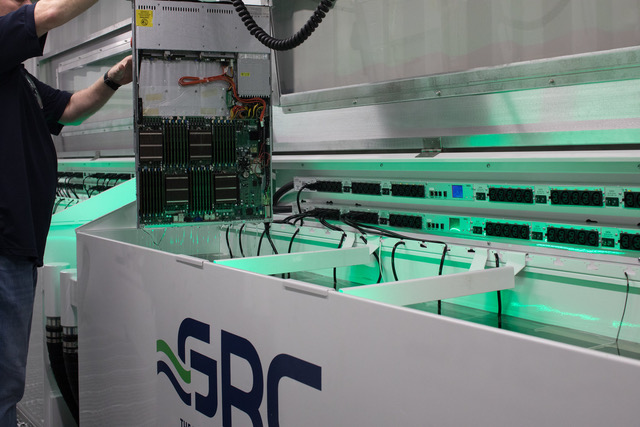 Figure 2. Data center immersion-cooling system with rack-mounted service rails for easy maintenance and hot swaps. (Image: GreenRevolutionCooling)