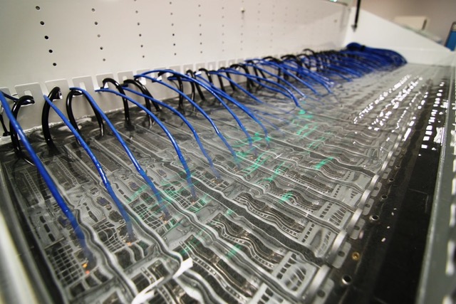 Figure 3. Data center infrastructure submerged in a liquid cooling solution. (Image: AKCP)